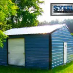 Steel building garage with blue walls and black trim.